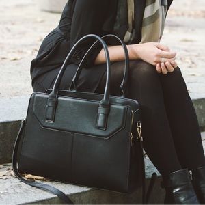 Black faux leather tote. Fits laptop.